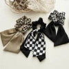 Early spring new black and white checkered large intestine circle bow ribbon hair accessory, thousand bird checkered large intestine hair circle elastic hair band accessory Application Scenario